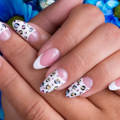 Beautiful woman's nails with beautiful french manicure and art design
