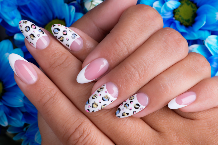 Beautiful woman's nails with beautiful french manicure and art design