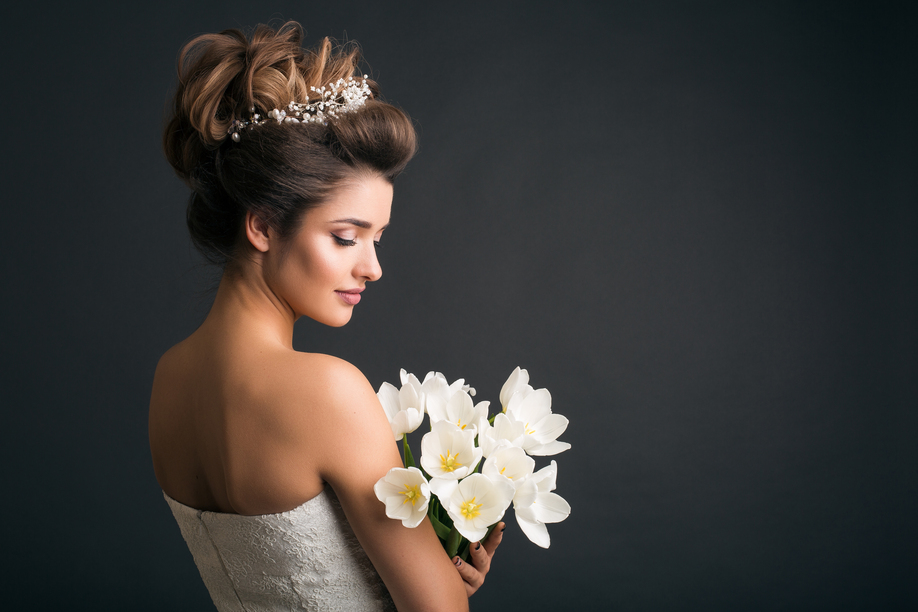 young beautiful stylish woman, bride, bridal fashion, spring trend, flowers, tulips, hairstyle, beauty make-up, white dress, tenderness, innocence, dark background