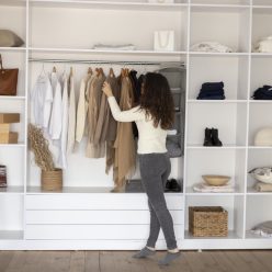 full-shot-woman-checking-wardrobe (1)