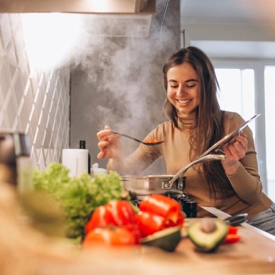 Woman cooking at kitchen