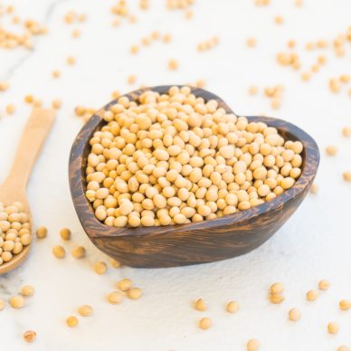 Yellow soy beans in wooden bowl - Healthy and Nutrition food concept