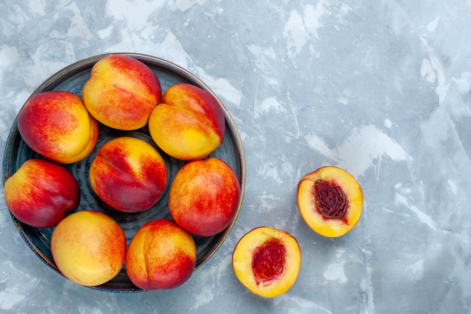 top view fresh ripe peaches delicious summer fruits on light-white desk fresh fruits mellow vitamine ripe tree