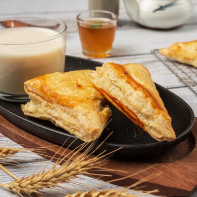 Chicken pie or kurnik that is beautifully decorated on the table.