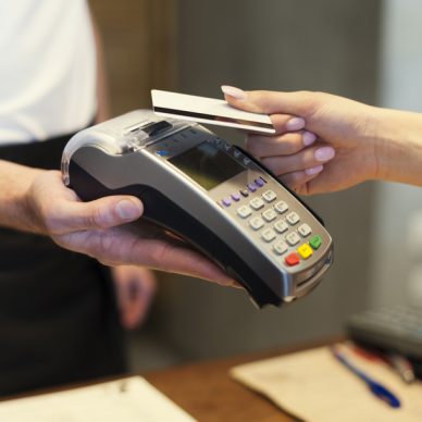 Close up of customer paying by credit card