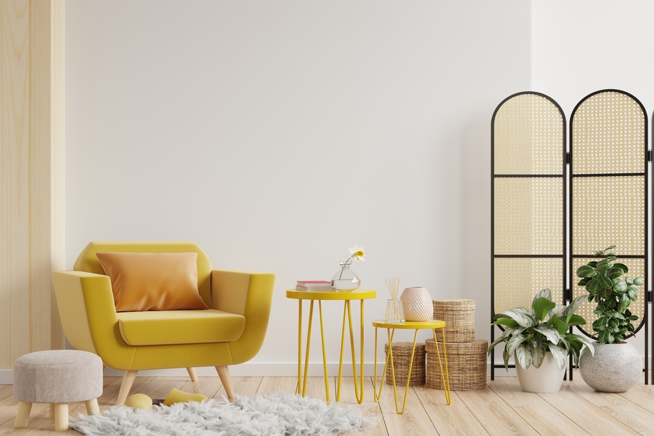 Living room interior wall mockup in warm tones with yellow armchair on white wall background.3d rendering