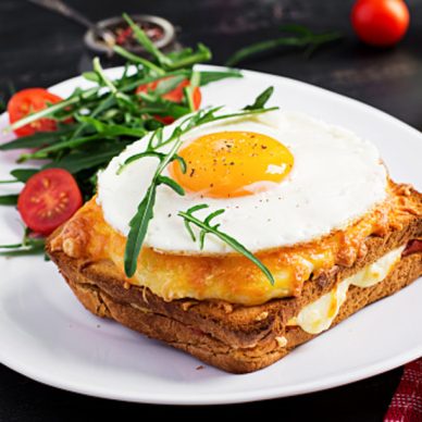 Breakfast. French cuisine. Croque madame sandwich close up on the table.