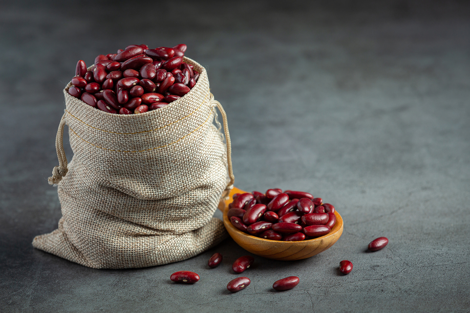 Red kidney beans in sack bag and with wooden spoon