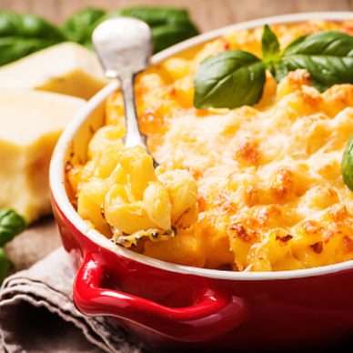 Mac and cheese, american style macaroni pasta in cheesy sauce