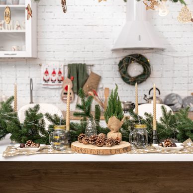 Bright modern kitchen decorated for Christmas with lots of decorative details.