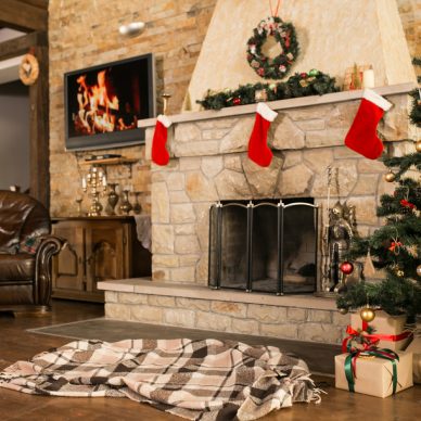 Room with christmas tree and fire place