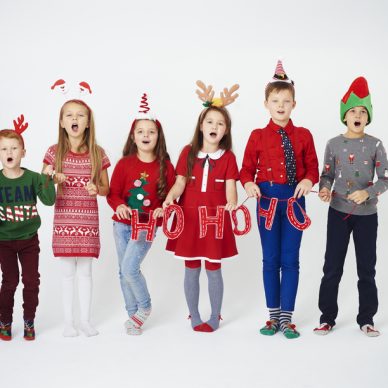 Happy children singing christmassy carols