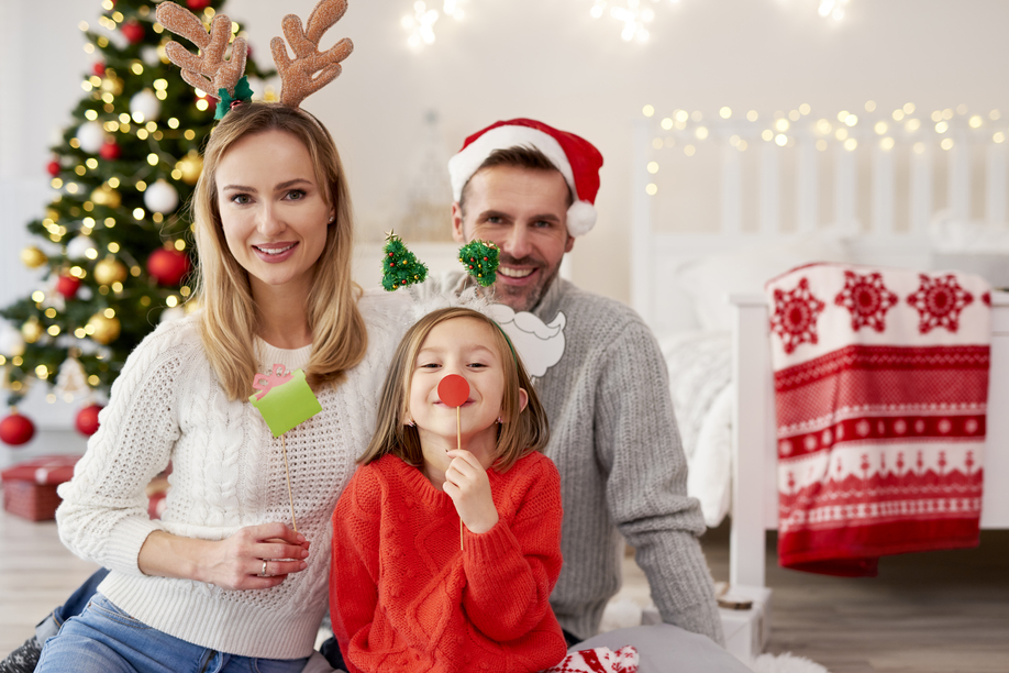 Portrait of smiling family in Christmas masks