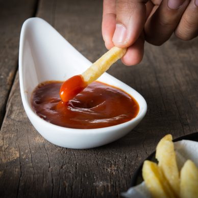 Chip shop chip dripping tomato ketchup.
