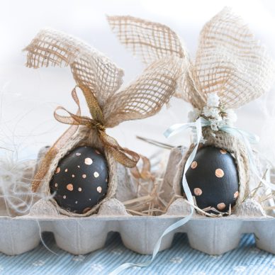 Decorated Easter eggs in black with gold pattern. The concept of the Easter holiday .
