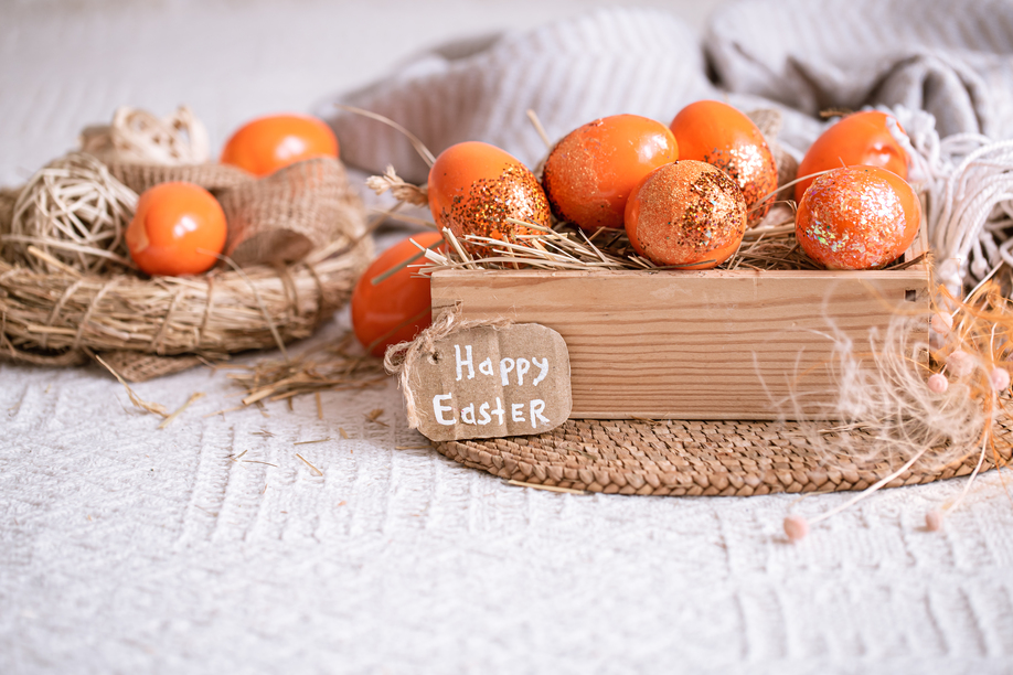 Easter still life with orange eggs, holiday decor . Easter cozy mood.