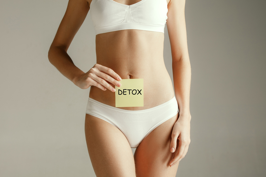 Female belly with drawing word DETOX. Metabolism, stomach, woman, health weight concept