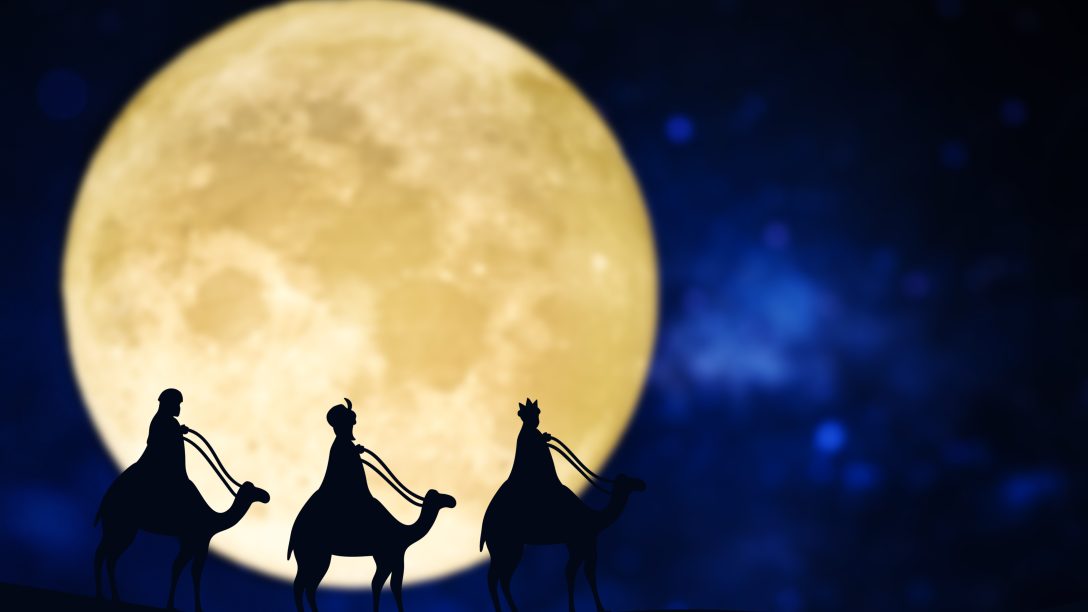 Three wise men silhouette over a full moon