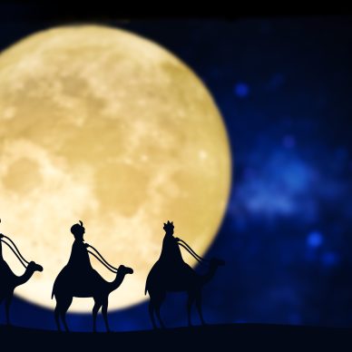 Three wise men silhouette over a full moon