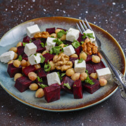 Delicious beet salad with feta cheese or goat cheese and chickpe