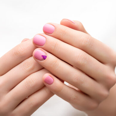 Female hands with pink nail design