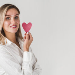 woman-posing-with-heart-copy-space (1)