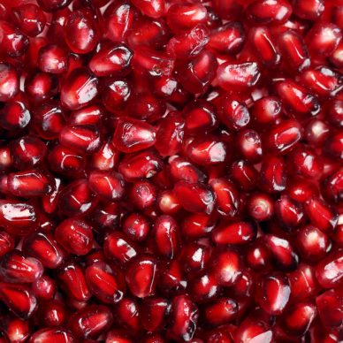 Delicious, exotic pomegranate fruit on white background