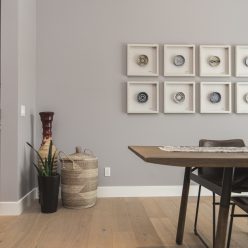 Interior shot of a modern house dining room with art on the wall