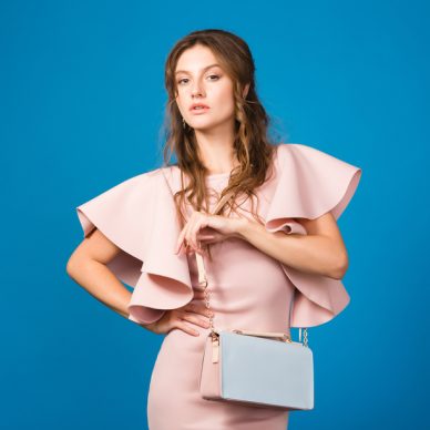 young beautiful stylish woman in black dress, red hat, sunglasses, red lipstick, happy, smiling, sexy, elegant