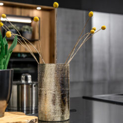 Decorative shiny vase in the interior of a modern kitchen.