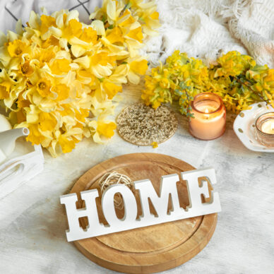 Spring still life with a Cup of tea and flowers . Light background, blooming and cozy house.