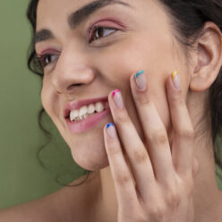 close-up-smiley-woman-with-french-manicure (1)
